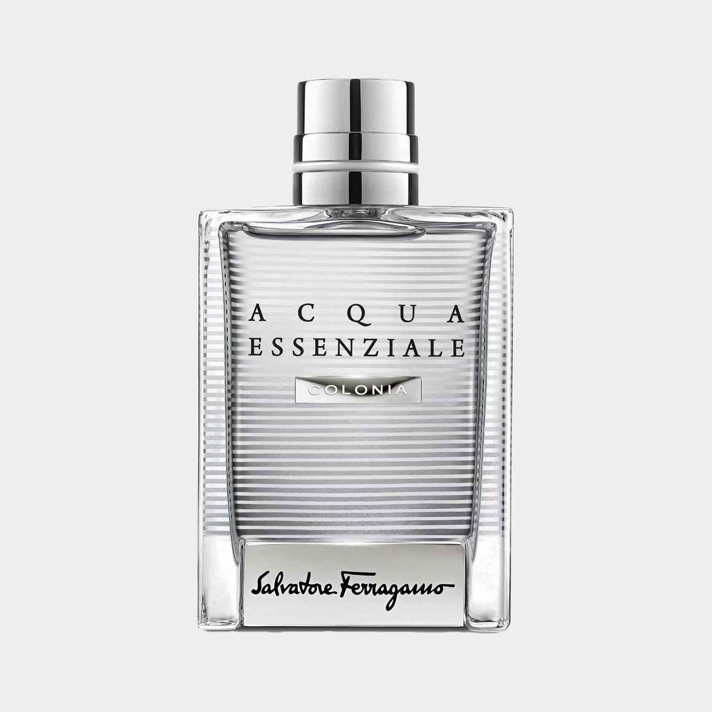 A sleek, rectangular sample bottle of Salvatore Ferragamo Acqua Essenziale Colonia, featuring a clear glass design with horizontal stripes and a silver cap. The label showcases the brand name in elegant typography.