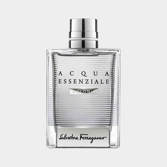 A sleek, rectangular sample bottle of Salvatore Ferragamo Acqua Essenziale Colonia, featuring a clear glass design with horizontal stripes and a silver cap. The label showcases the brand name in elegant typography.
