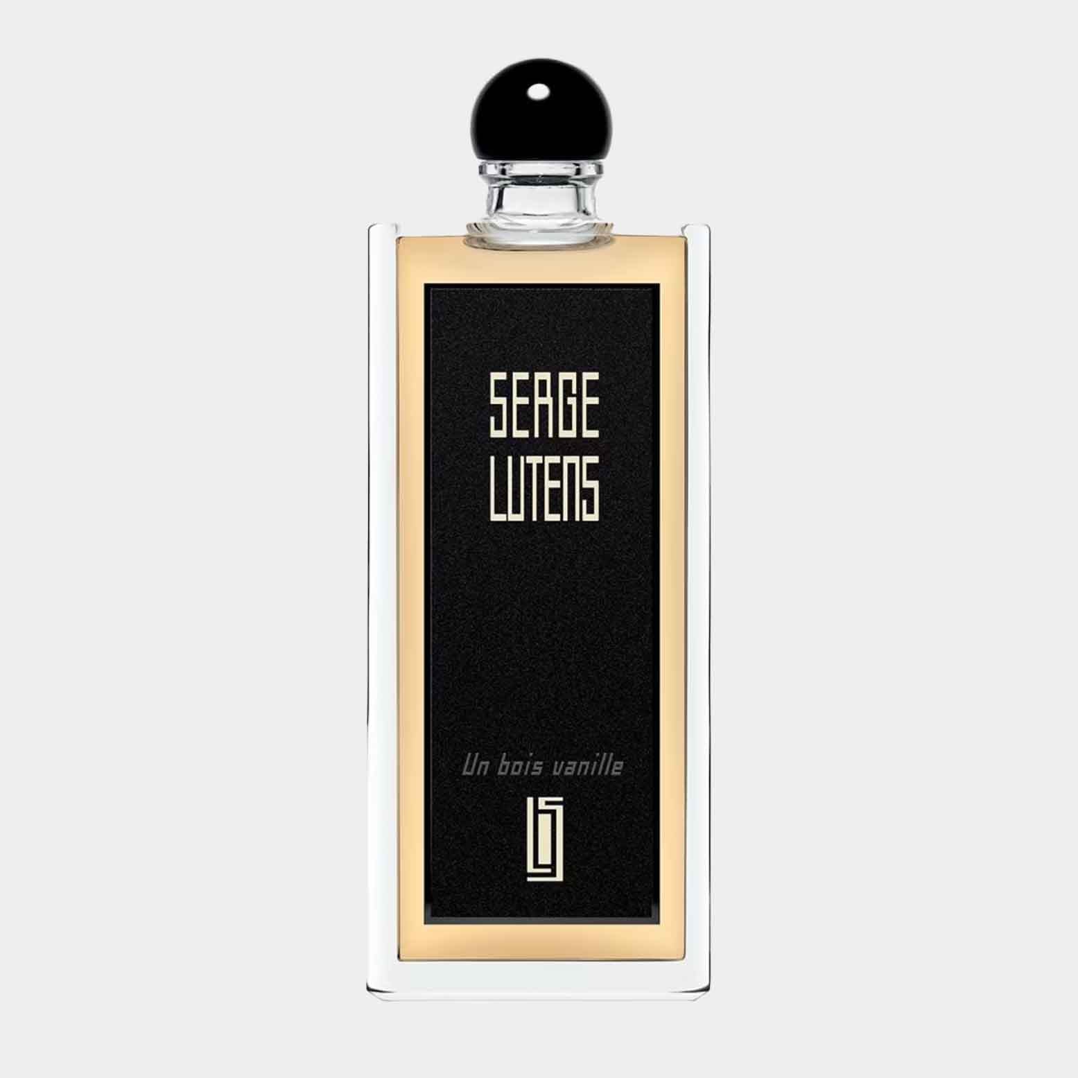 A sample bottle of Serge Lutens Un Bois Vanille EDP, featuring a sleek design with a black and gold label and a round black cap. The bottle reflects a luxurious fragrance experience.