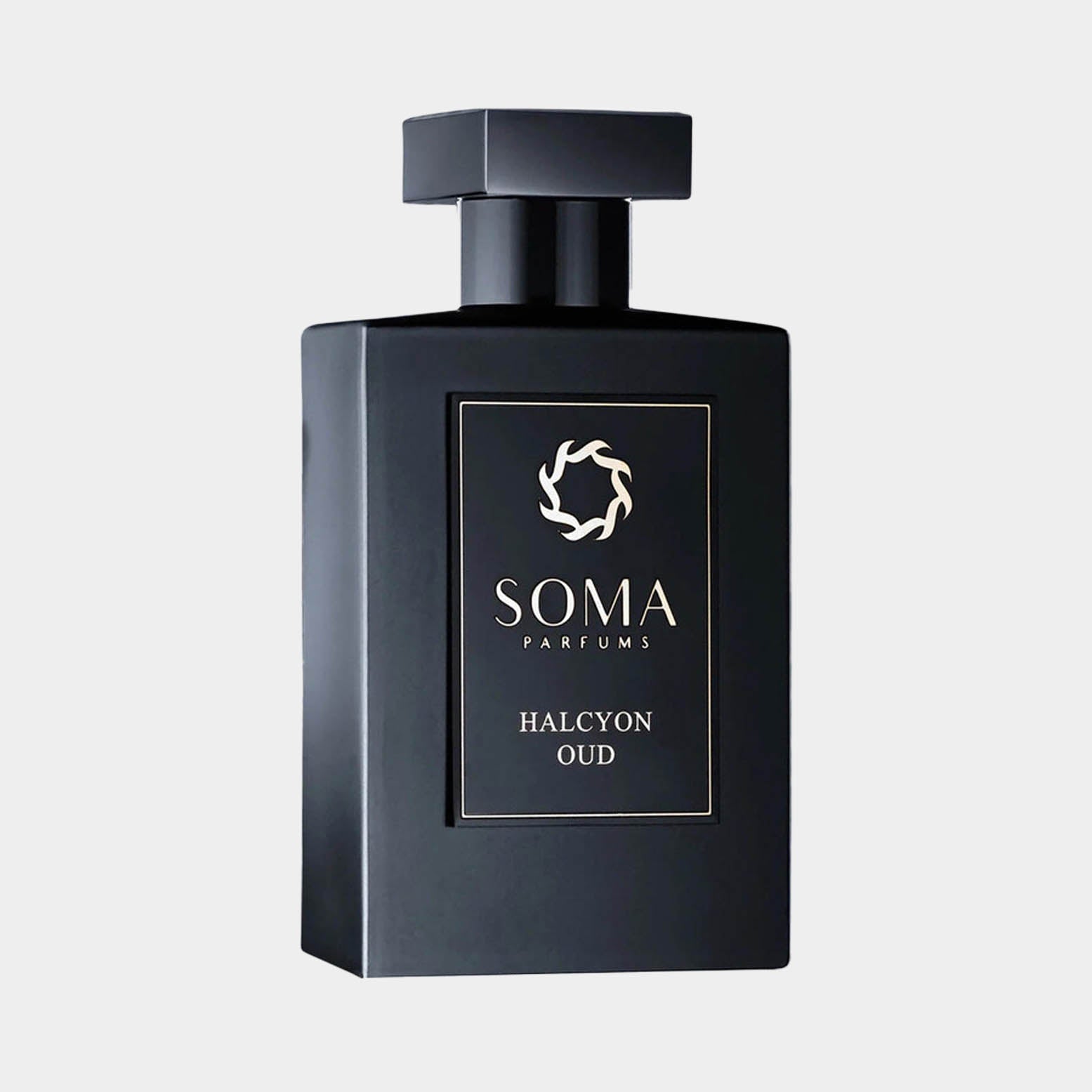 Black rectangular bottle of Soma Parfums Halcyon Oud Sample, featuring a sleek design and a minimalist logo on the front. The bottle is capped with a square top, emphasizing its elegant and modern aesthetic.