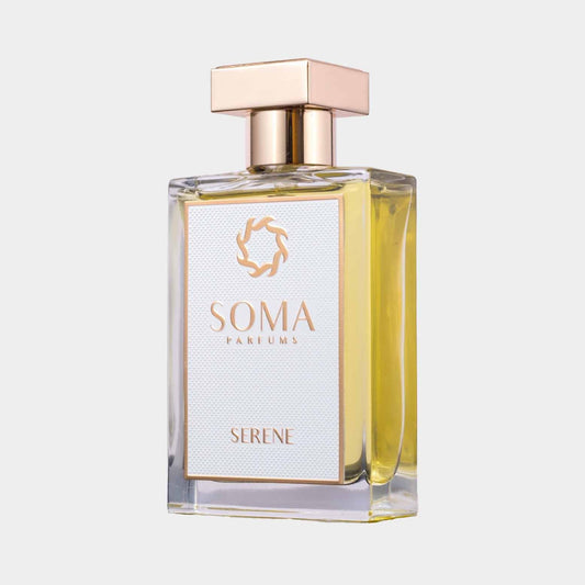 Soma Parfums Serene Sample bottle featuring a sleek glass design with a gold cap and elegant label. The fragrance is a soft yellow hue, embodying a tranquil essence.
