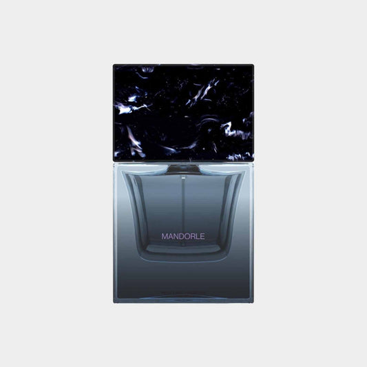Sora Dora Mandorle Sample fragrance bottle featuring a sleek design and a dark, marbled cap.