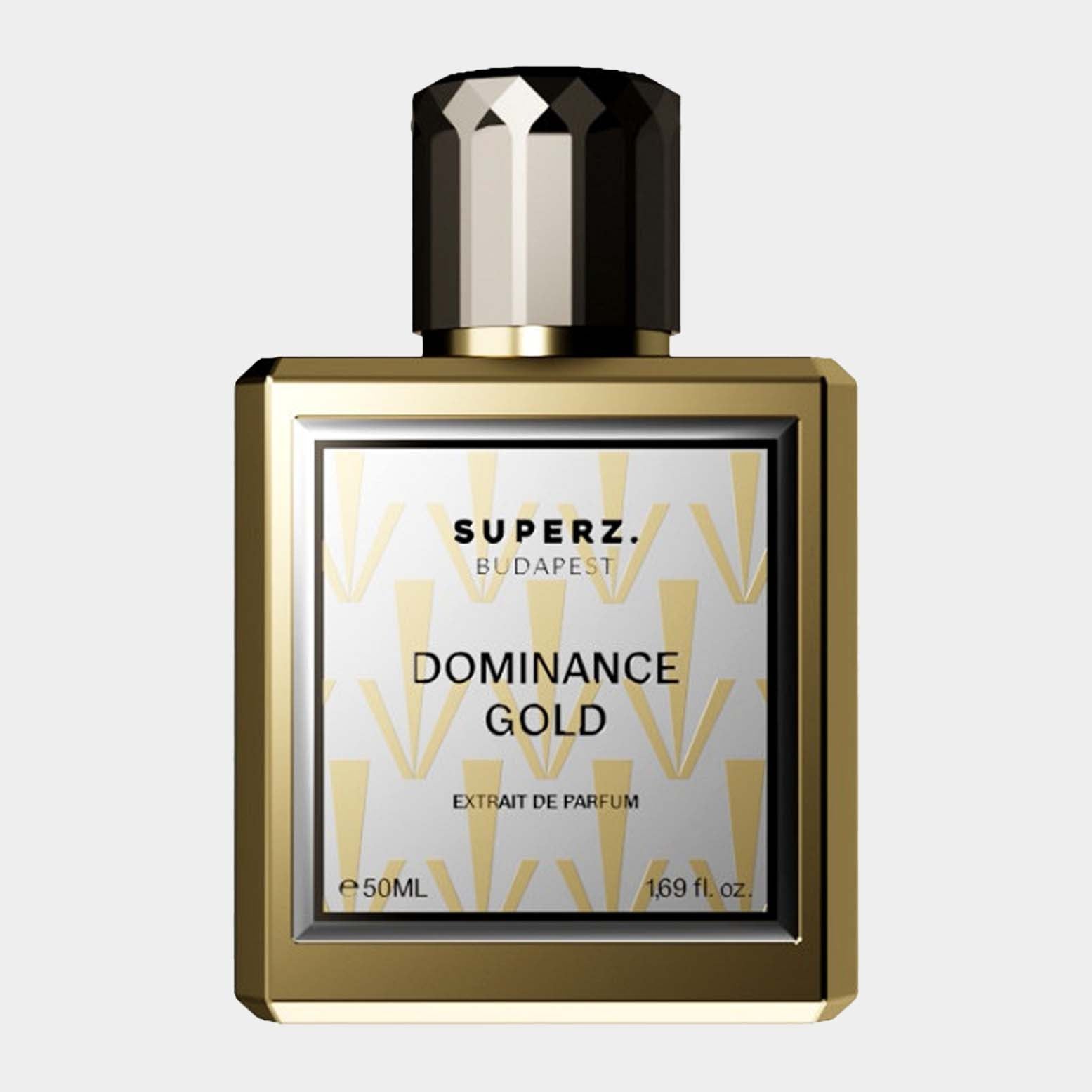 A full bottle of Superz Dominance Gold, an extrait de parfum, featuring an elegant gold and white design with a distinctive hexagonal cap. The bottle holds 50ml of fragrance.