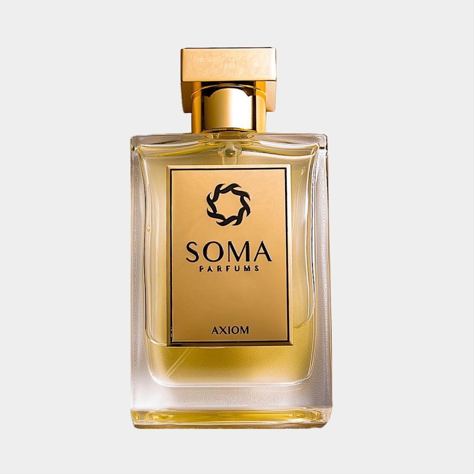A Soma Parfums Axiom sample bottle, featuring a sleek glass design with a golden cap and a label showcasing the brand name and fragrance title. The liquid inside is a warm, golden hue.