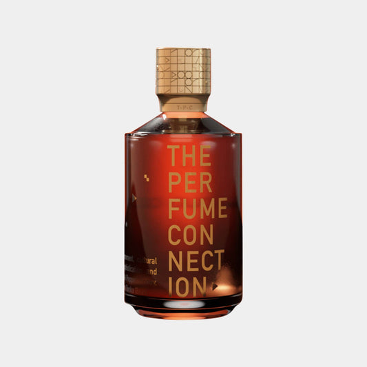 A bottle of The Perfume Connection (TPC) Oud Connection Sample, featuring a rich, amber liquid in a sleek, modern design with bold lettering. The cap is elegantly designed, reflecting a luxurious fragrance experience.