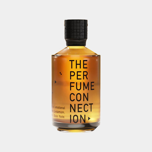 A bottle of The Perfume Connection (TPC) Amber Solar Sample, featuring a minimalist design with bold black lettering against a warm amber liquid. The bottle is topped with a textured black cap.
