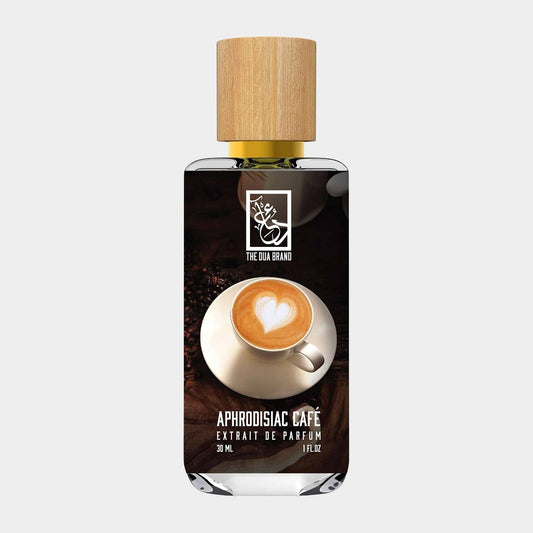 A bottle of Dua Aphrodisiac Cafe perfume, featuring a stylish design with a wooden cap and a background image of a coffee cup with a heart-shaped foam design. The bottle contains 30 ml of fragrant essence.