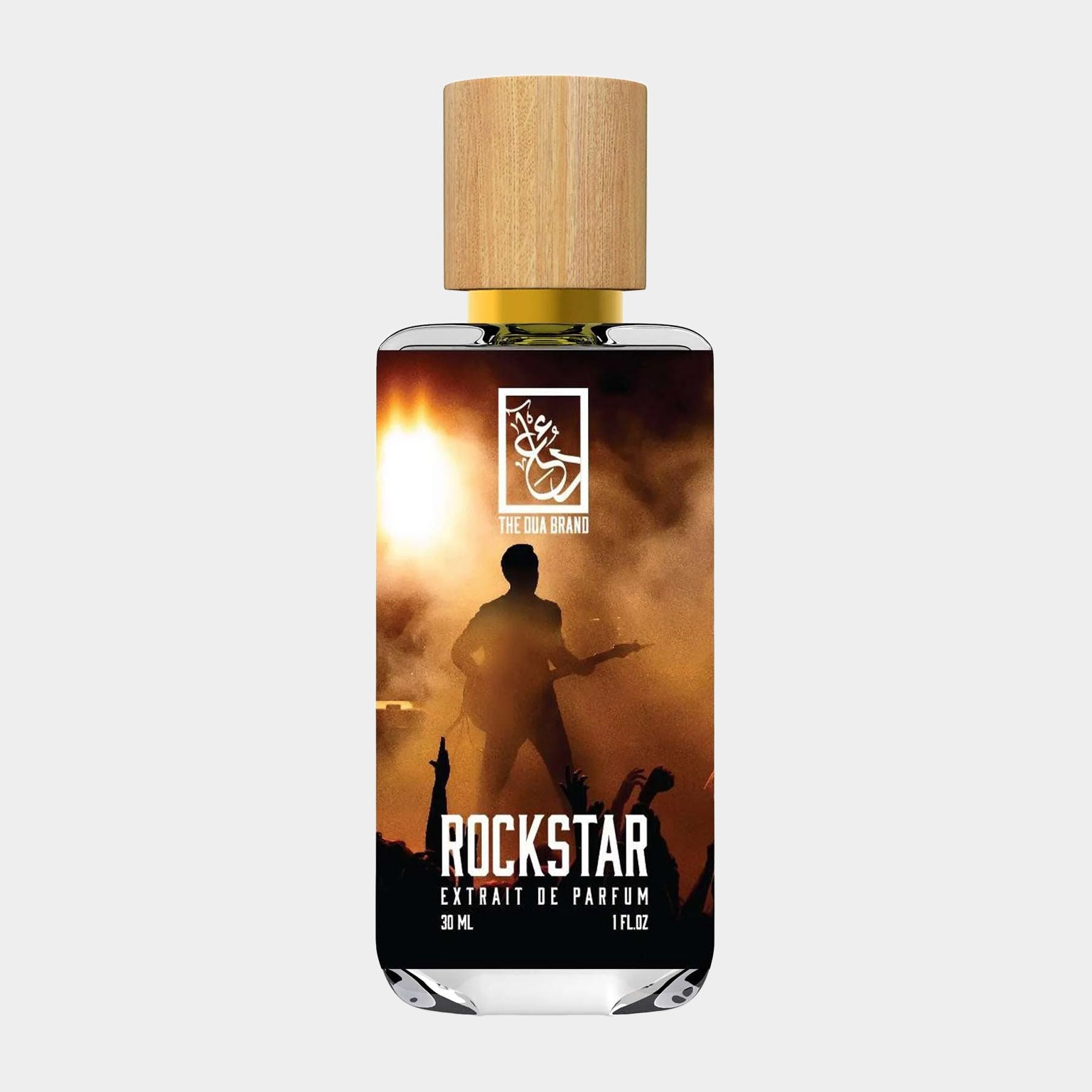 A bottle of Dua Rockstar Sample fragrance, featuring a sleek design with a wooden cap and a label showcasing a silhouette of a performer against a vibrant concert backdrop. The bottle contains 30 mL of perfume.