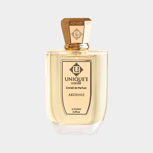 A luxurious perfume bottle of Unique'e Luxury Akdeniz, featuring a gold cap and elegantly shaped glass, containing 100 ml of fragrant extrait de parfum.