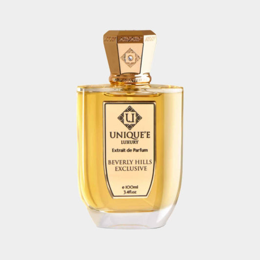 A luxurious bottle of Unique'e Luxury Beverly Hills Exclusive Sample, showcasing a stylish design with a golden cap, containing 100ml of Extrait de Parfum.