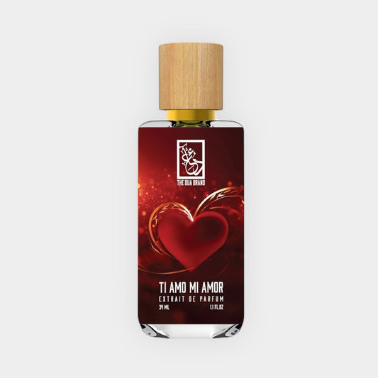 A bottle of Dua Ti Amo Mi Amor Sample perfume featuring a heart design, with a wooden cap and a deep red label, offering a luxurious scent in a 37 ml size.