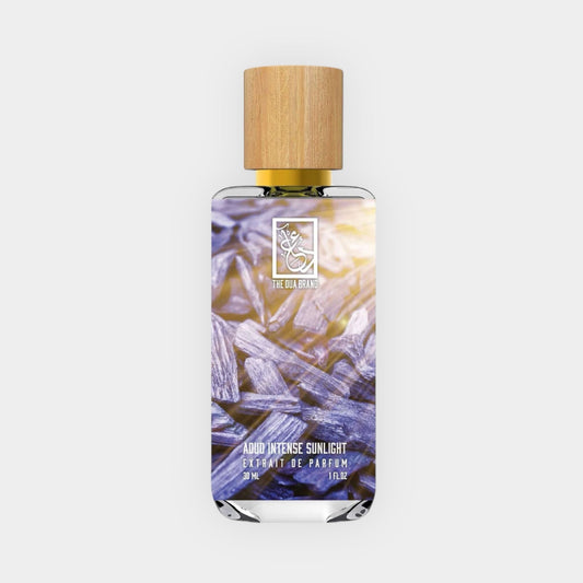 Dua Aoud Intense Sunlight Sample perfume bottle featuring a natural wooden cap and a vibrant label showcasing a blend of rich, earthy tones.