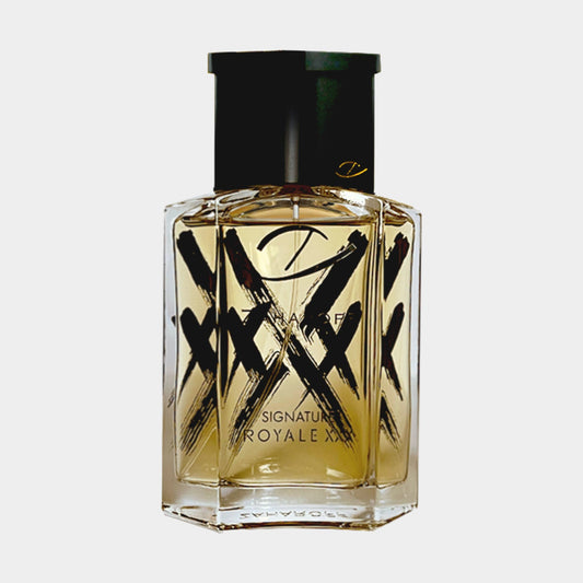 A clear bottle of Zaharoff Signature Royale XXX Sample with an elegant design, featuring bold black brushstroke accents and a black cap, showcasing its luxurious fragrance.