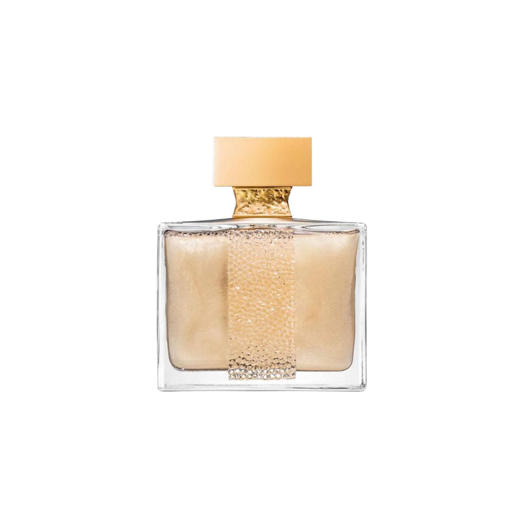 A full bottle of M. Micallef Ylang in Gold perfume, featuring a sleek, elegant design with a gold cap and a shimmering amber liquid inside.
